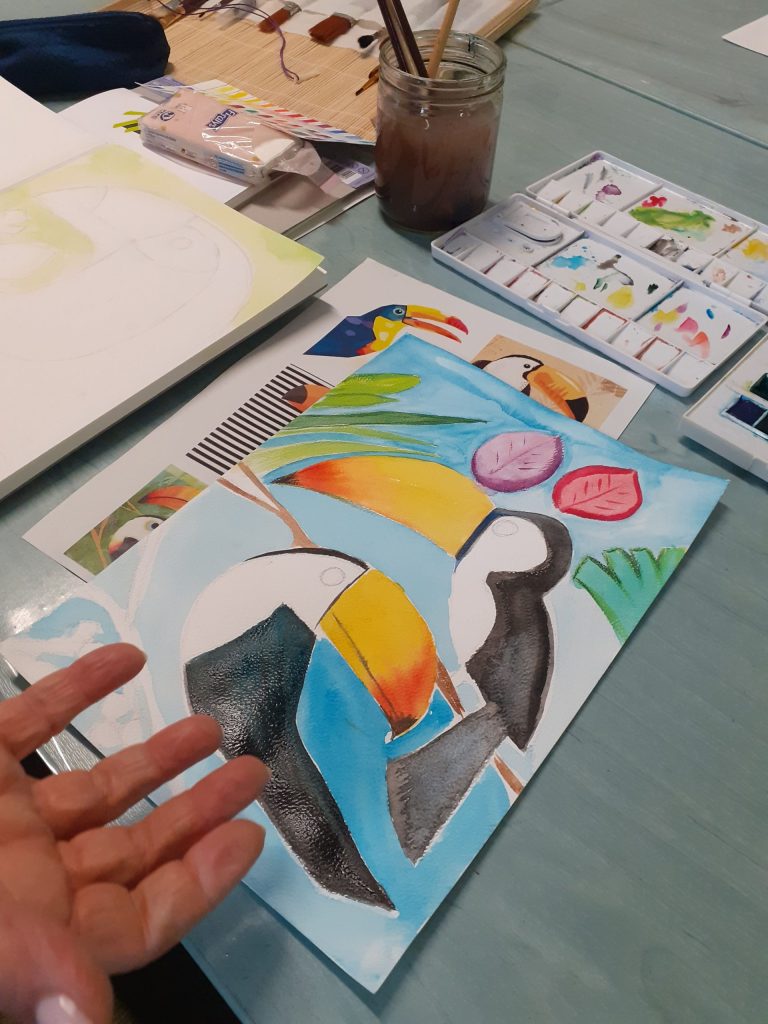 Peinture à l'aquarelle réalisée par un élève représentant deux oiseaux colorés
